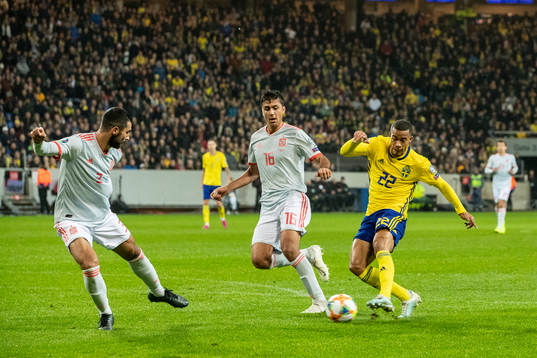 Robin Quaison of Sweden against Raul Albiol and Rodri of