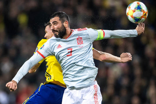 Marcus Berg of Sweden and Raul Albiol of Spain