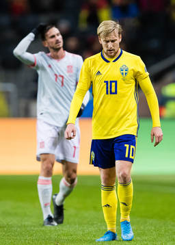 Fabian Ruiz of Spain and Emil Forsberg of Sweden