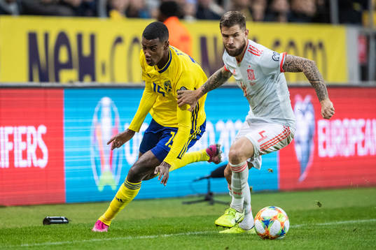 Alexander Isak of Sweden and Inigo Martinez of Spain