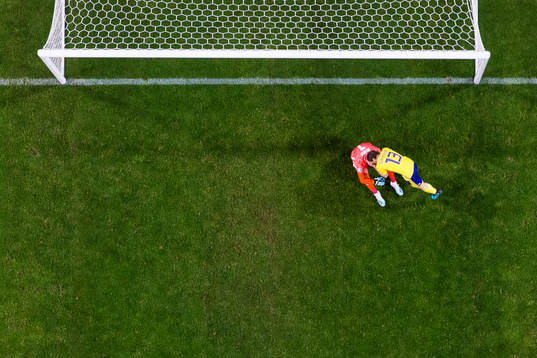 Goalkeeper Robin Olsen and Gustav Svensson of Sweden looks