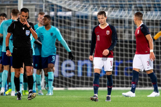 Håkon Evjen of Norway looks dejected