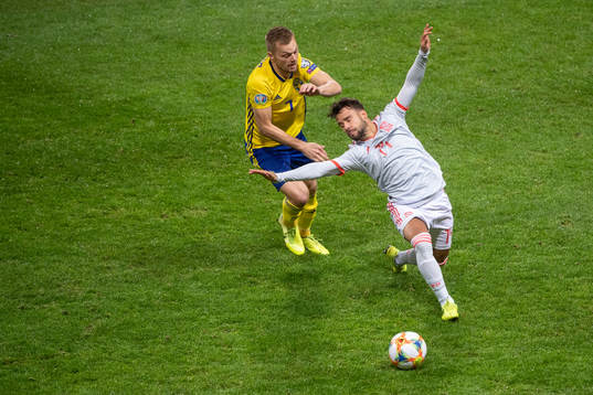 Sebastian Larsson of Sweden and Juan Bernat of Spain