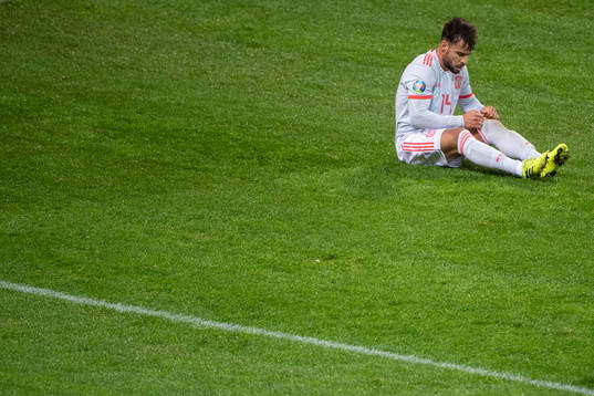 Juan Bernat of Spain looks dejected
