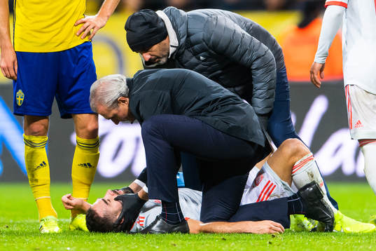 Dani Carvajal of Spain lies downand gets medical attention