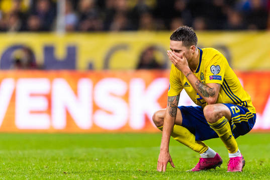 Mikael Lustig of Sweden looks dejected