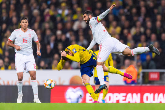 Marcus Berg of Sweden competes for the ball with Raul Albiol