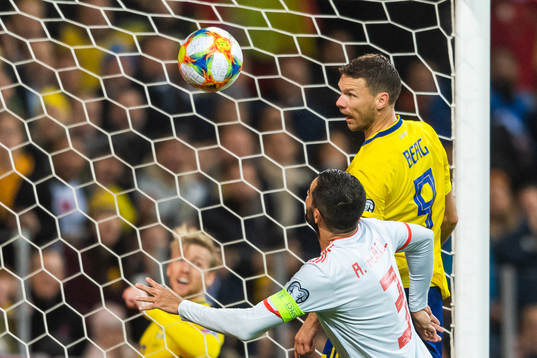 Marcus Berg of Sweden scores 1-0 in competition with Raul
