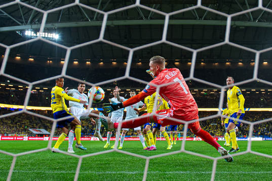 Goalkeeper Robin Olsen of Sweden makes a save