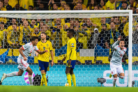 Marcus Berg and Alexander Isak look dejected as Rodrigo of
