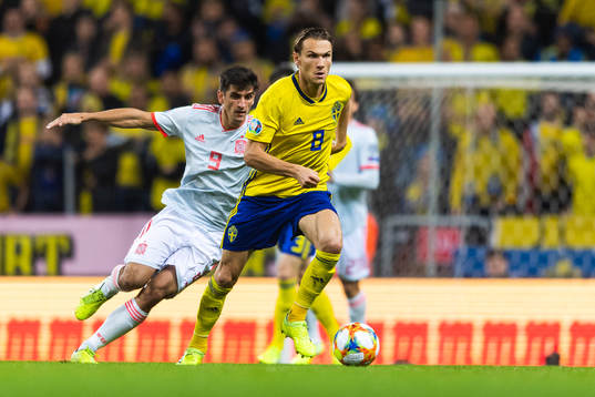 Gerard Moreno of Spain and Albin Ekdal of Sweden