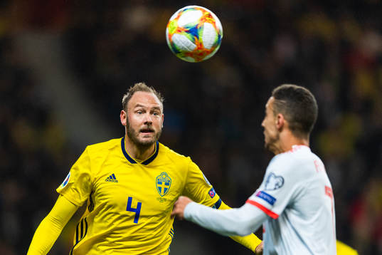 Andreas Granqvist of Sweden and Rodrigo of Spain