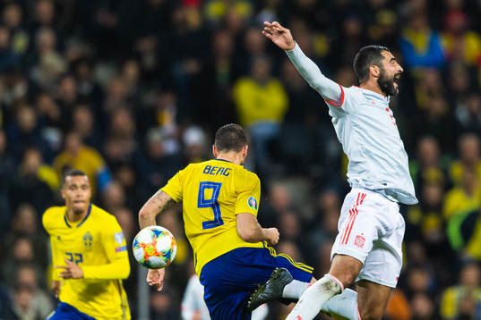 Marcus Berg of Sweden and Raul Albiol of Spain
