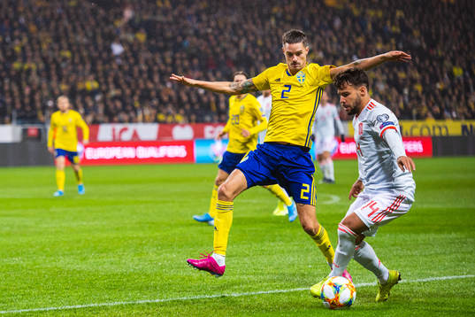 Mikael Lustig of Sweden and Juan Bernat of Spain