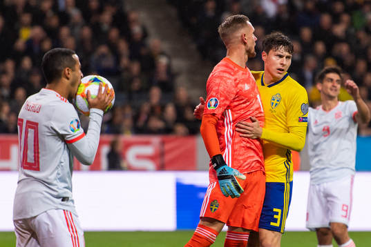 Goalkeeper Robin Olsen celebrates a save with Victor
