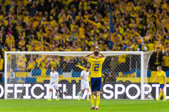 Mikael Lustig of Sweden looks dejected