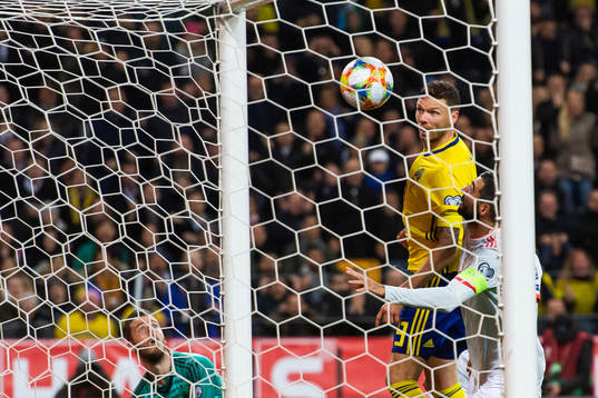 Goalkeeper David de Gea and Raul Albiol of Spain see Marcus