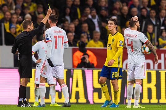 Fabian Ruiz of Spain and Kristoffer Olsson of Sweden
