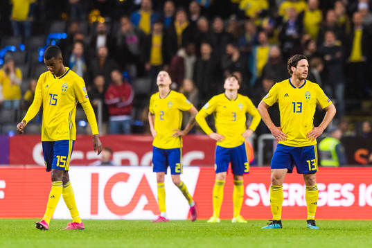 Alexander Isak and Gustav Svensson of Sweden look dejected