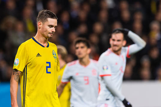 Mikael Lustig of Sweden looks dejected