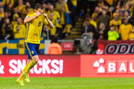Albin Ekdal of Sweden goes off to change his shirt because