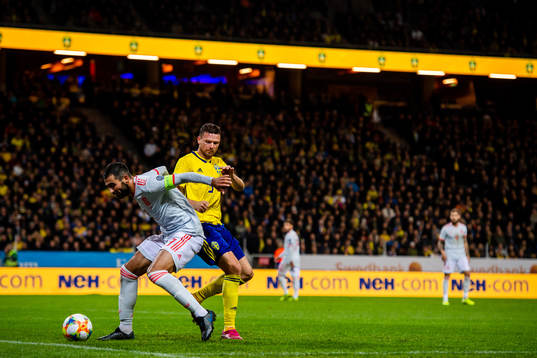 Raul Albiol of Spain against Marcus Berg of Sweden