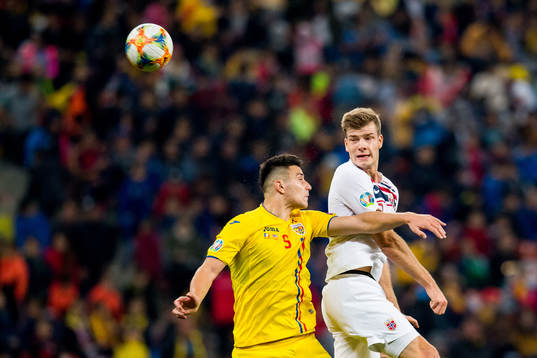 Ionut Nedelcearu of Romania and Alexander Sørloth of Norway