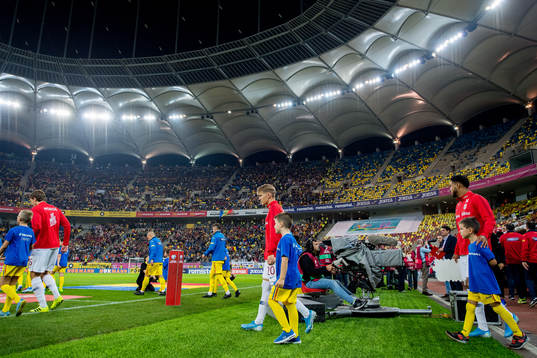 Martin Ødegaard and Joshua King of Norway enter the pitch