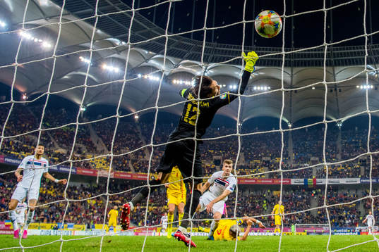 Alexander Sørloth of Norway scores 1-1 behind goalkeeper