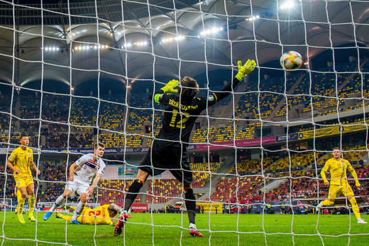 Alexander Sørloth of Norway scores 1-1 behind goalkeeper