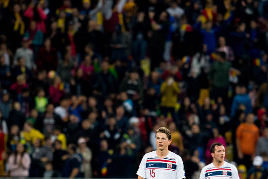 Sander Berge and Even Hovland of Norway look dejected