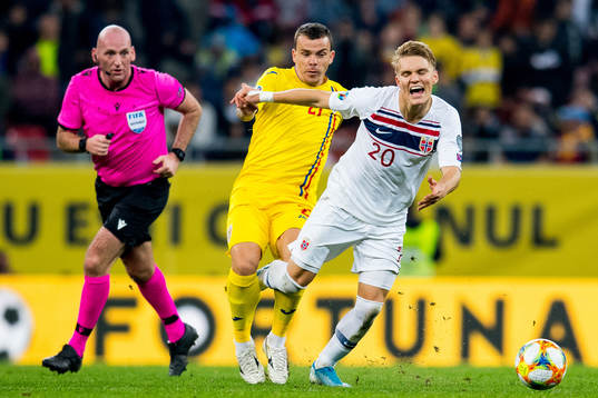 Dan Nistor of Romania and Martin Ødegaard of Norway