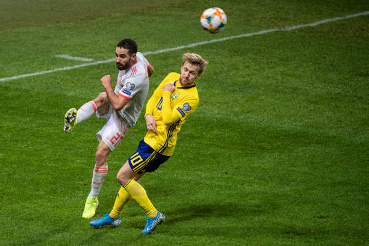 Dani Carvajal of Spain and Emil Forsberg of Sweden
