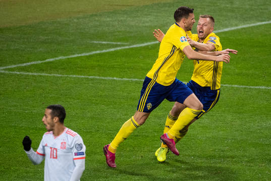 Marcus Berg and Sebastian Larsson of Sweden celebrates as