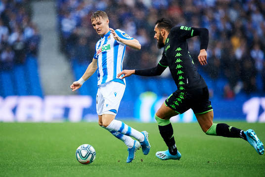 Martin Odegaard of Real Sociedad battles for the ball with