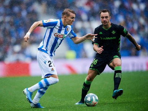 Martin Odegaard of Real Sociedad battles for the ball with