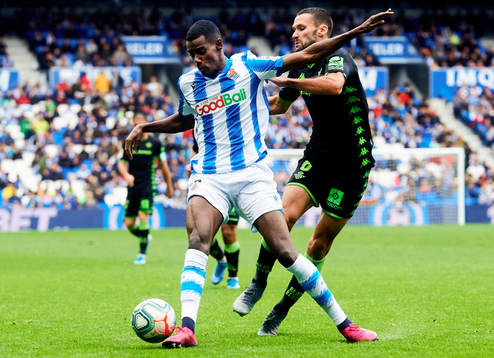 Alexander Isak of Real Sociedad battles for the ball with