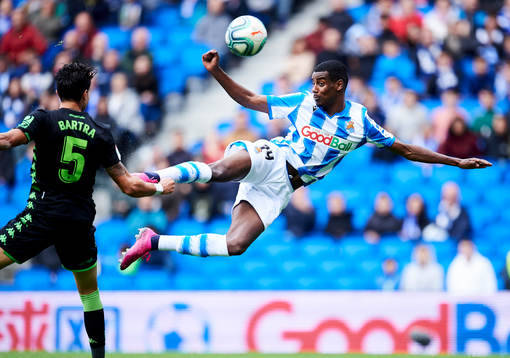 Alexander Isak of Real Sociedad battles for the ball with