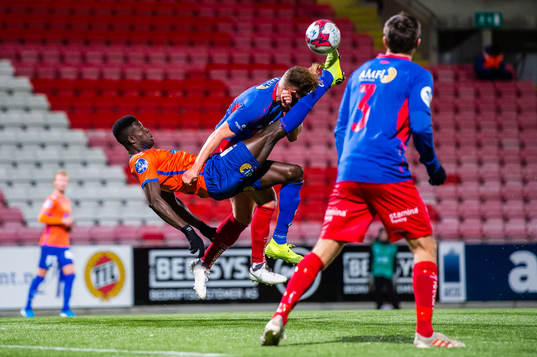 Pape Habib Gueye of Aalesund and Henrik Malde Breimyr of