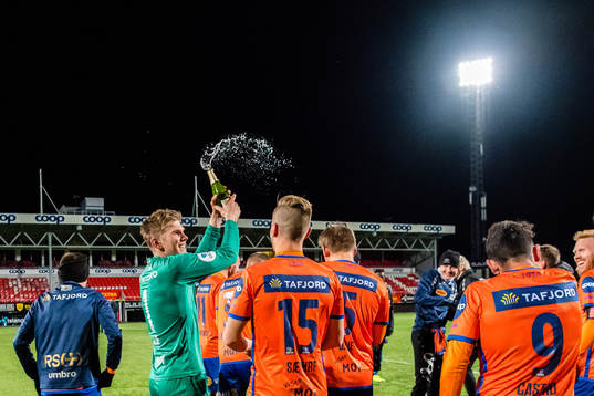 Andreas Lie of Aalesund celebrates promotion to the