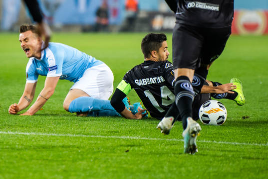 Eric Larsson of Malmö FF and Jonathan Sabbatini of Lugano