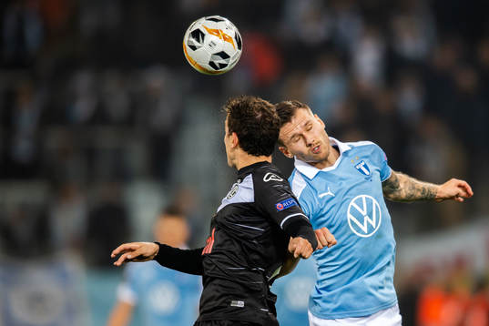 Arnor Traustason of Malmö FF and Olivier Custodio of Lugano