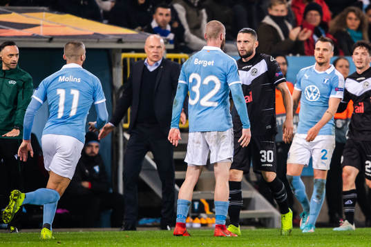 Jo Inge Berget of Malmö FF in a dispute with Fabio Daprela