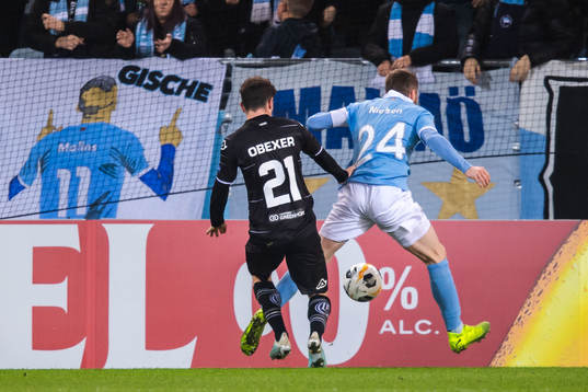 Lasse Nielsen of Malmö FF and Linus Obexer of Lugano