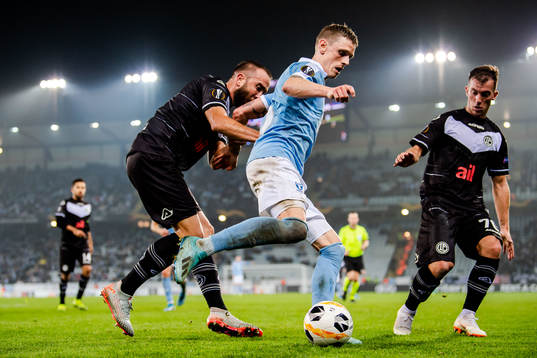 Sören Rieks of Malmö FF against Mijat Maric and Marco