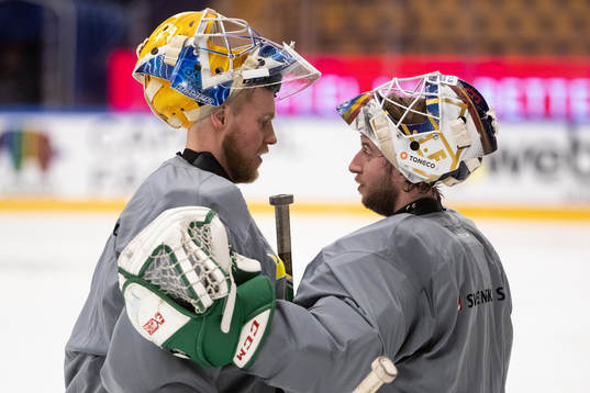 Goaltender Adam Reideborn and goaltender Magnus Hellberg of