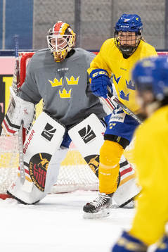 Goaltender Sara Grahn and Josefine Holmgren of Sweden