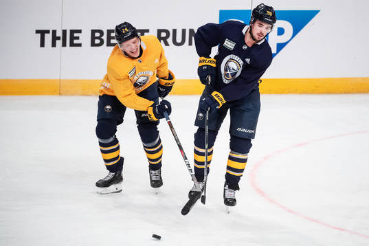 Lawrence Pilut and Marcus Johansson of Buffalo Sabres