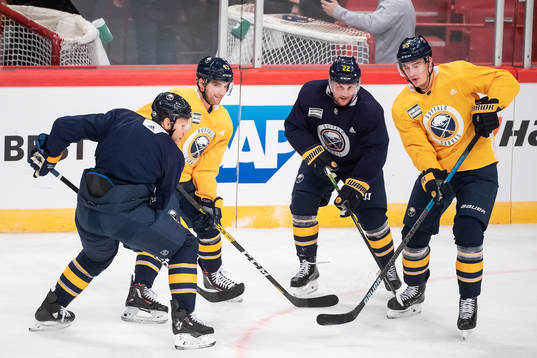 Conor Sheary, Johan Larsson and Rasmus Ristolainen of
