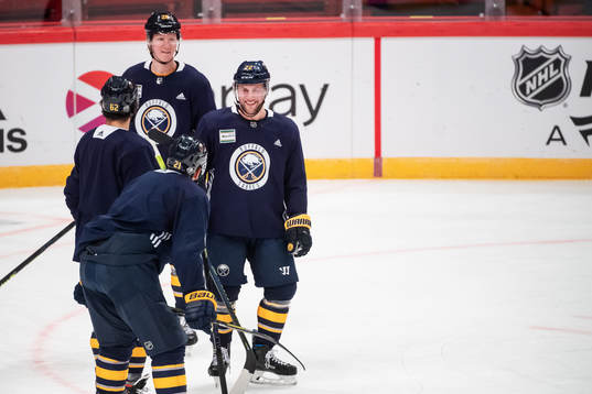 Rasmus Dahlin and Johan Larsson of Buffalo Sabres
